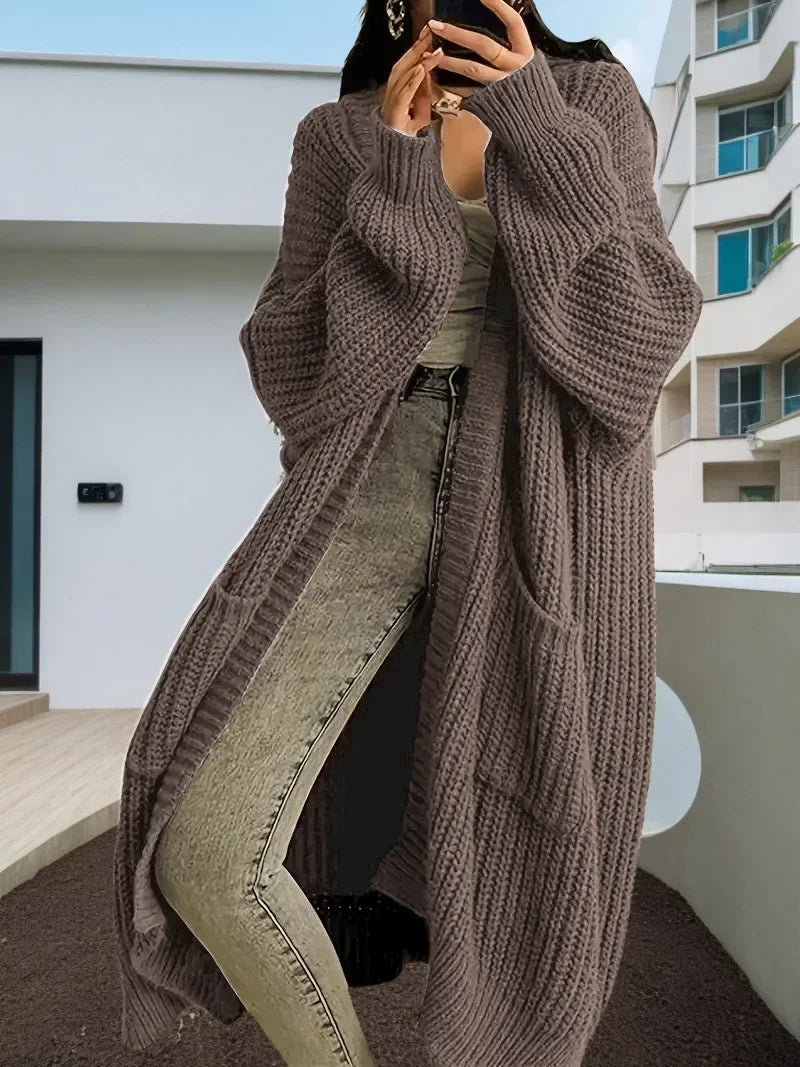 Oversized spring knitted V-neck cardigan.