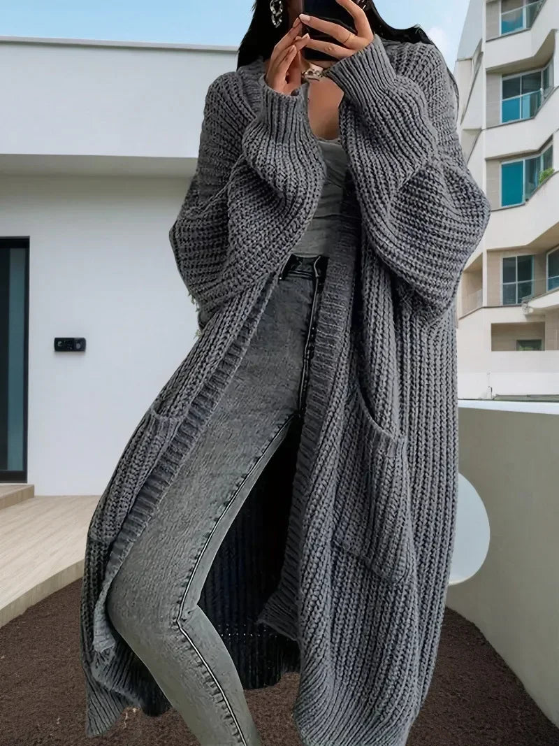 Oversized spring knitted V-neck cardigan.