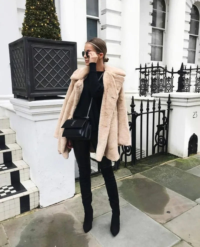 Mid-length faux fur coat — warm, plush, and stylish for winter.