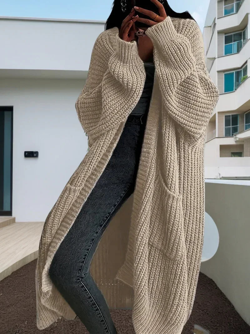 Oversized spring knitted V-neck cardigan.