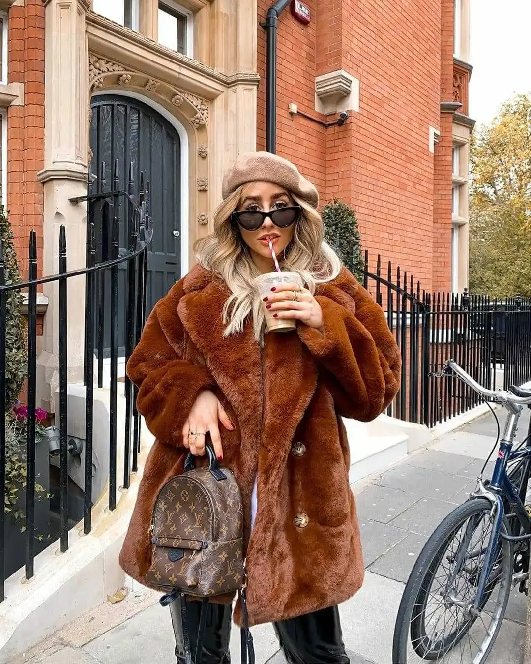 Mid-length faux fur coat — warm, plush, and stylish for winter.
